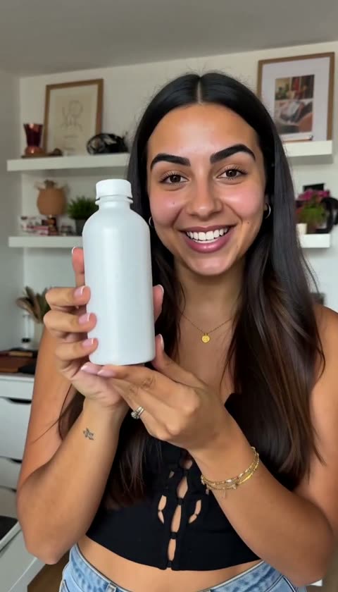 AI-generated presenter facing the camera and holding a white bottle