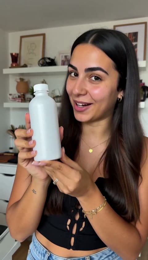 AI-generated presenter smiling and holding a white bottle