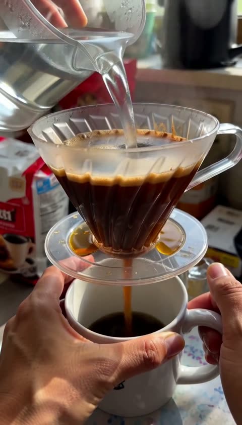 AI-generated hands pouring water through a coffee dripper